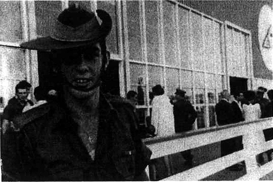 Mervyn Mason in slouch hat and uniform at Mascot Airport on his return home