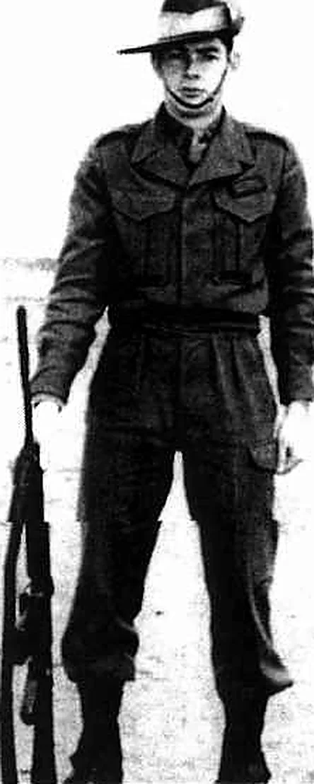 Mervyn Mason in uniform during recruit training, holding a rifle